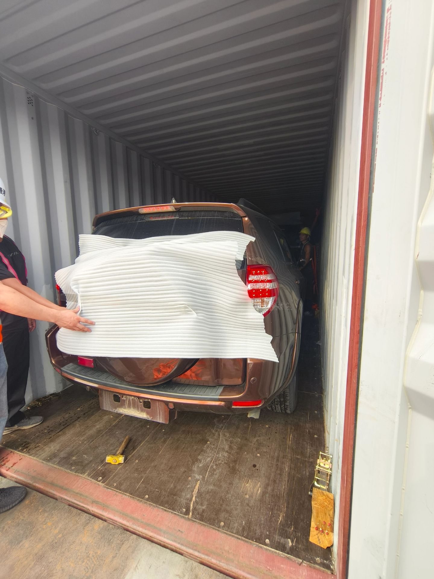 Vehicle wrapped and secured inside a container — China to Toamasina service