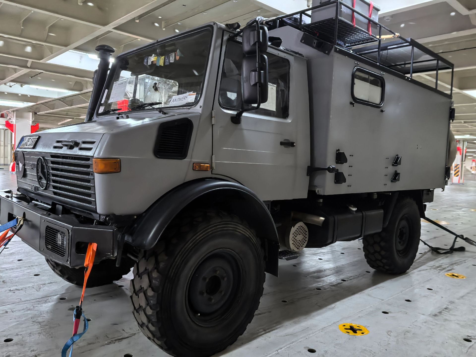 Off-road vehicle lashed by the wheels inside a RoRo deck