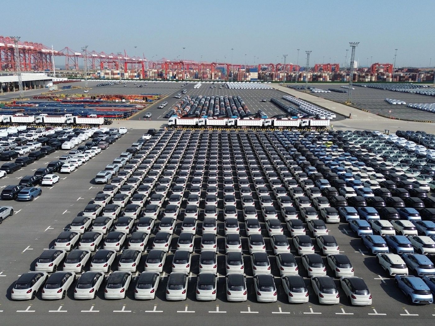 Aerial view of an export terminal with new vehicles staged in rows waiting to load